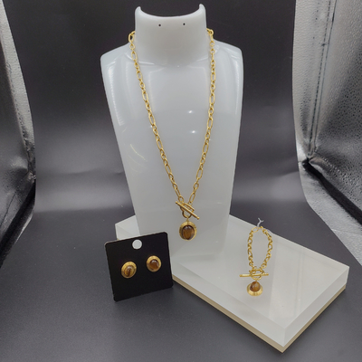 Les dernières boucles d'oreilles en acier inoxydable de couleur or, collier, bracelet avec pierre pour femme